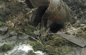 Selly Excavating using a mini excavator to remove old culvert piping